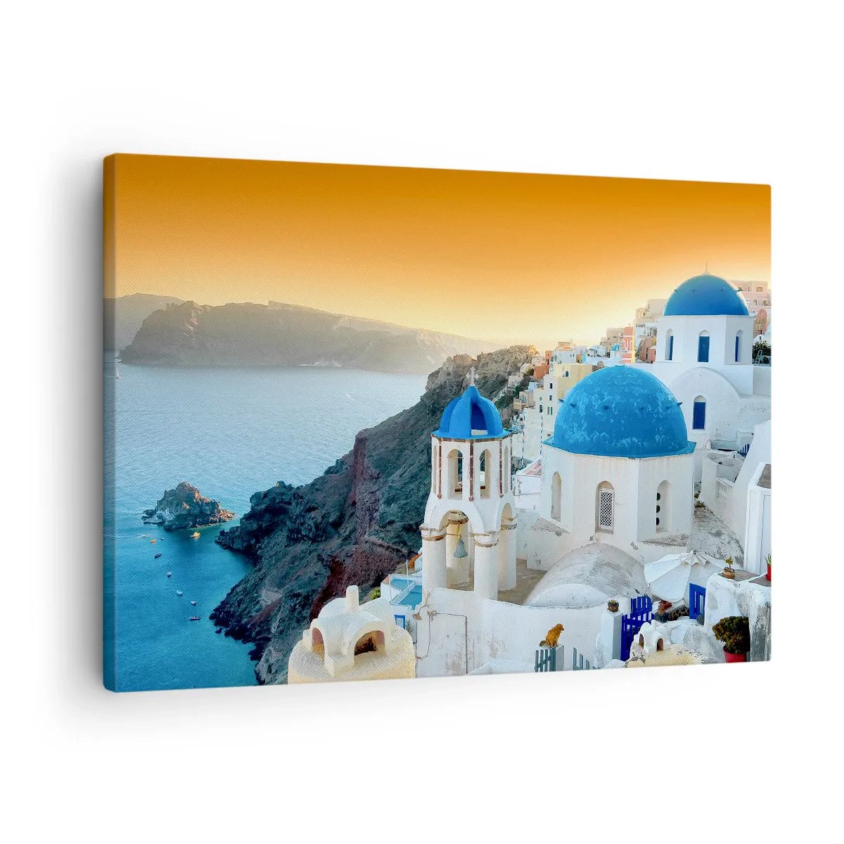 Obraz na płótnie - Widok na Santorini z białymi budynkami i błękitnym morzem - 70x50cm - Santorini - przytulone do skał - Nowoczesna dekoracja ścienna do salonu i sypialni ARTTOR