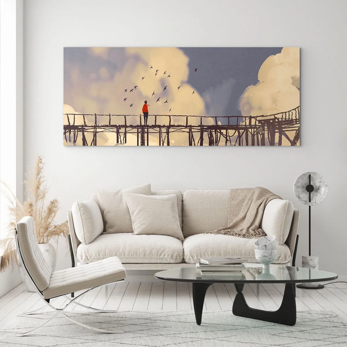 Obraz na szkle - Postać na moście wśród chmur z ptakami na tle nieba - 120x50cm - Niebieska tęsknota - Nowoczesna dekoracja ścienna do salonu i sypialni ARTTOR