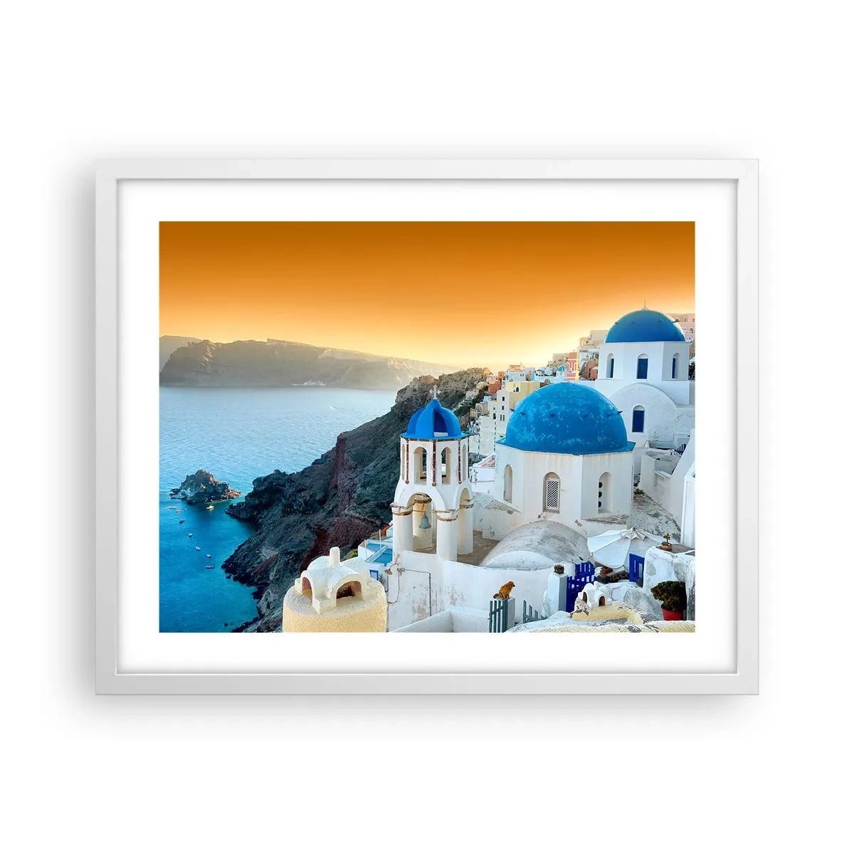 Plakat w białej ramie - Santorini - przytulone do skał - 50x40 cm