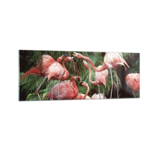 Obraz na szkle - Grupa flamingów w tropikalnym otoczeniu palm - 140x50cm - Popołudniowe ploteczki - Nowoczesna dekoracja ścienna do salonu i sypialni ARTTOR