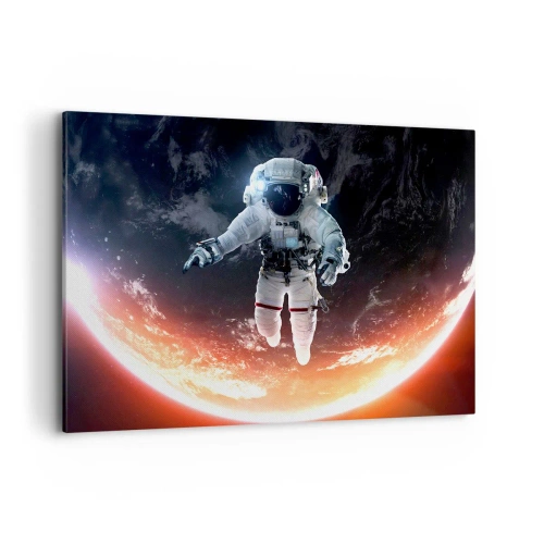 Obraz na płótnie - Astronauta unoszący się nad Ziemią oświetloną słońcem - 100x70cm - Mogę zostać jeszcze chwilę? - Nowoczesna dekoracja ścienna do salonu, kuchni i sypialni ARTTOR