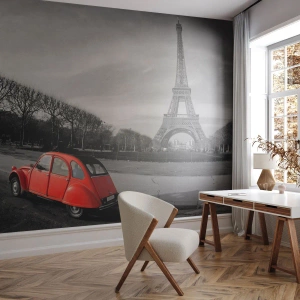 Fototapeta Premium Sand - Czerwony samochód na tle wieży w czarno-białym Paryżu - 100x70cm - Bardziej paryskie niż sam Paryż - Nowoczesna dekoracja ścienna do salonu, kuchni i sypialni ARTTOR