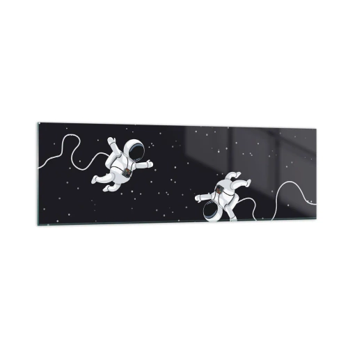 Obraz na szkle - Astronauci unoszący się w kosmosie na tle gwiazd - 160x50cm - Kosmiczny pląs - Nowoczesna dekoracja ścienna do salonu i sypialni ARTTOR