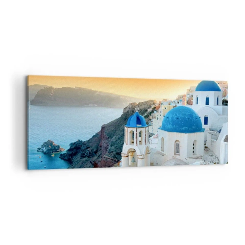 Obraz na płótnie - Widok na Santorini z białymi budynkami i błękitnym morzem - 120x50cm - Santorini - przytulone do skał - Nowoczesna dekoracja ścienna do salonu i sypialni ARTTOR