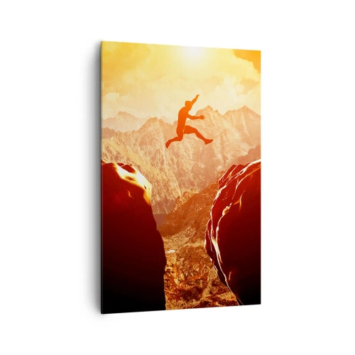 Obraz na płótnie - Postać skacząca między skałami na tle gór - 80x120cm - Przekraczając granice - Nowoczesna dekoracja ścienna do salonu i sypialni ARTTOR