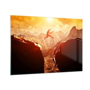Obraz na szkle - Skok przez przepaść w górskim krajobrazie o zachodzie słońca - 100x70cm - Przekraczając granice - Nowoczesna dekoracja ścienna do salonu, kuchni i sypialni ARTTOR