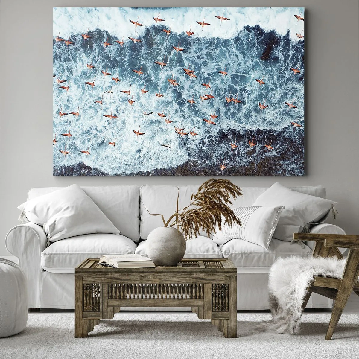Obraz na płótnie - Różowe flamingi nad błękitnym oceanem z lotu ptaka - 100x70cm - Nadmorska parada - Nowoczesna dekoracja ścienna do salonu, kuchni i sypialni ARTTOR