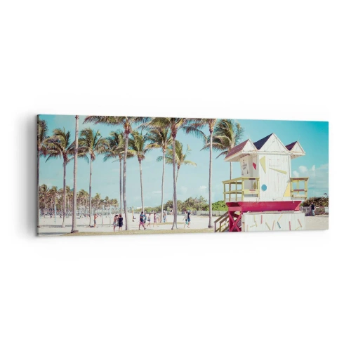 Obraz na płótnie - Plaża z palmami i wieżą ratowniczą w tle - 140x50cm - Przed tobą piękny dzień - Nowoczesna dekoracja ścienna do salonu i sypialni ARTTOR