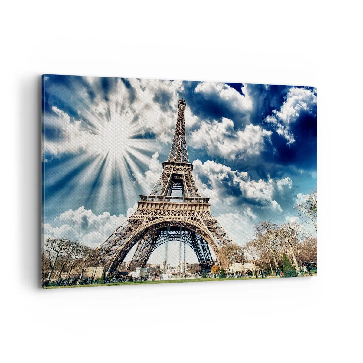 Obraz na płótnie - Wieża Eiffla na tle słonecznego nieba z chmurami - 120x80cm - Jedyna taka pod słońcem - Nowoczesna dekoracja ścienna do salonu, kuchni i sypialni ARTTOR
