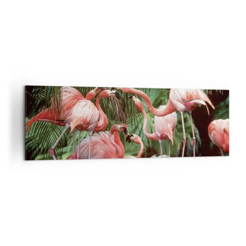 Obraz na płótnie - Grupa flamingów w tropikalnym otoczeniu palm - 160x50cm - Popołudniowe ploteczki - Nowoczesna dekoracja ścienna do salonu i sypialni ARTTOR