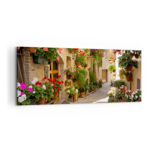 Obraz na płótnie - Uliczka z kwiatami w donicach i kamiennymi ścianami - 120x50cm - W kwiatów powodzi - Nowoczesna dekoracja ścienna do salonu i sypialni ARTTOR