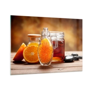 Obraz na szkle - Butelka z olejem i pomarańczą na drewnianym stole - 100x70cm - Słoneczne smaki i aromaty - Nowoczesna dekoracja ścienna do salonu, kuchni i sypialni ARTTOR