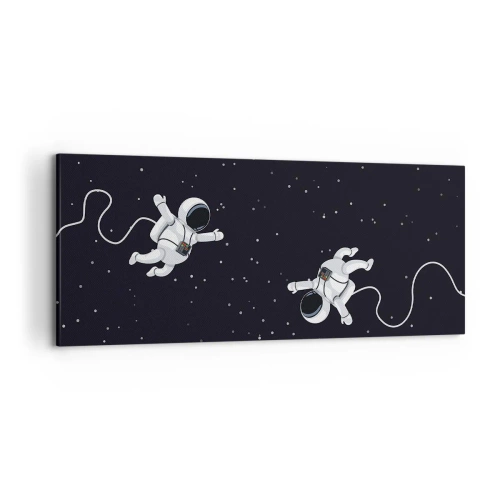 Obraz na płótnie - Astronauci unoszący się w kosmosie na tle gwiazd - 120x50cm - Kosmiczny pląs - Nowoczesna dekoracja ścienna do salonu i sypialni ARTTOR
