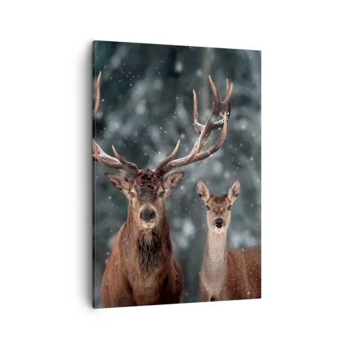Obraz na płótnie - Jeleń i łania w zimowym lesie na tle padającego śniegu - 50x70cm - Pan lasu z małżonką - Nowoczesna dekoracja ścienna do salonu, kuchni i sypialni ARTTOR