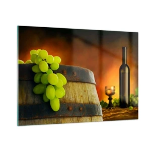 Obraz na szkle - Winogrona na beczce w rustykalnym otoczeniu z winem w tle - 100x70cm - Martwa natura z butelką wina i kiścią winogron - Nowoczesna dekoracja ścienna do salonu, kuchni i sypialni ARTTOR