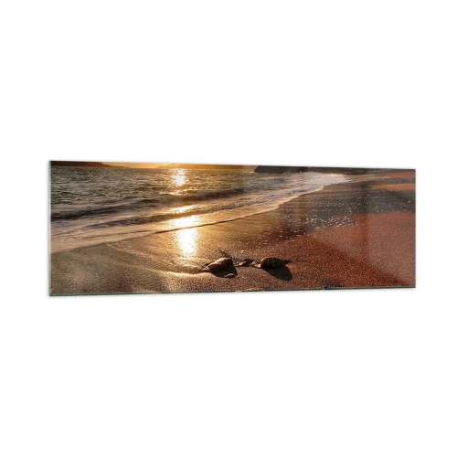 Obraz na szkle - Plaża o zachodzie słońca z kamieniami na brzegu - 160x50cm - Idź za słońcem ku wzgórzom - Nowoczesna dekoracja ścienna do salonu i sypialni ARTTOR
