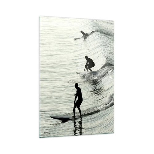 Obraz na szkle - Surferzy na falach w monochromatycznym ujęciu - 70x100cm - Na spotkanie fali - Nowoczesna dekoracja ścienna do salonu i sypialni ARTTOR