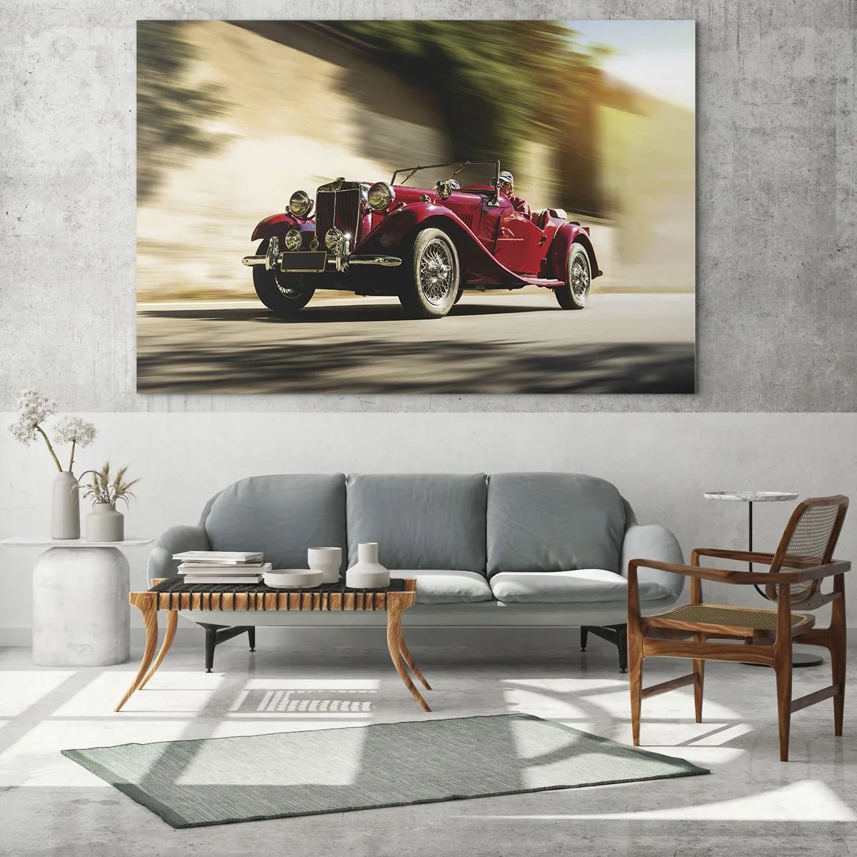 Obraz na szkle - Klasyczny czerwony kabriolet w ruchu na tle ulicy i rozmytego krajobrazu - 70x50cm - Piękniejszy niż Nike z Samotraki - Nowoczesna dekoracja ścienna do salonu i sypialni ARTTOR