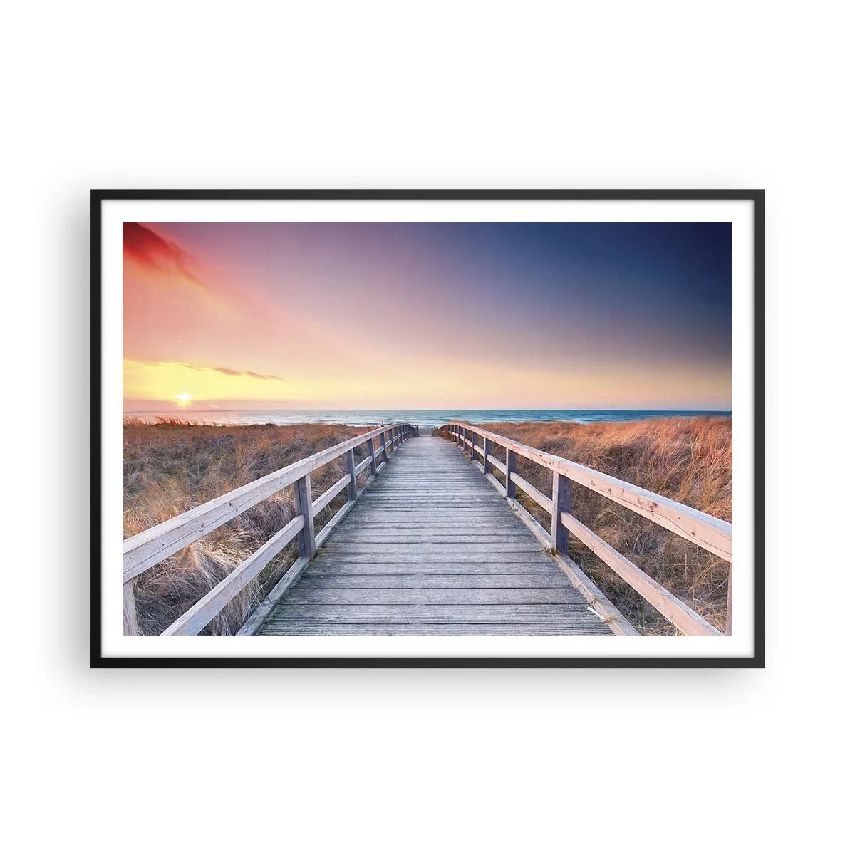 Plakat w czarnej ramie - Drewniany pomost prowadzący na plażę o zachodzie słońca z pastelowymi barwami nieba - 100x70cm - Bałtycka wieczorna zorza - Nowoczesna dekoracja ścienna do salonu i sypialni ARTTOR