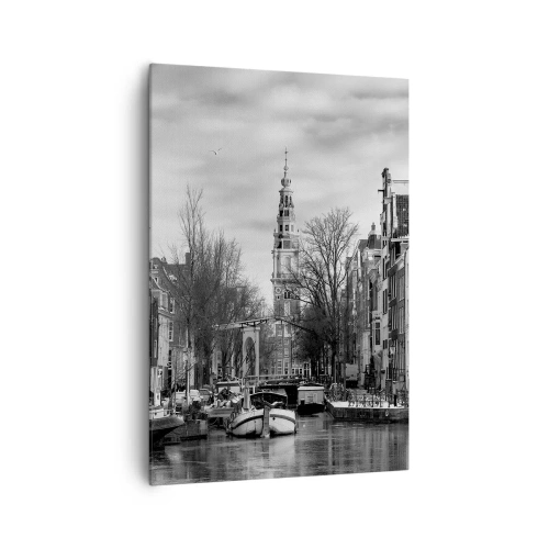 Obraz na płótnie - Czarno-biała panorama Amsterdamu z kanałem i zabytkowymi budynkami - 70x100cm - Amsterdamskie klimaty - Nowoczesna dekoracja ścienna do salonu i sypialni ARTTOR
