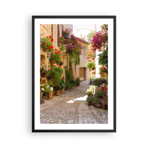 Plakat w czarnej ramie - Kwiecista uliczka z kamiennym brukiem i donicami pełnymi kwiatów - 50x70cm - W kwiatów powodzi - Nowoczesna dekoracja ścienna do salonu i sypialni ARTTOR
