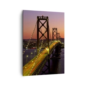Obraz na płótnie - Most oświetlony nocą z widokiem na miasto w tle - 50x70cm - Wieczór we fiolecie - Nowoczesna dekoracja ścienna do salonu, kuchni i sypialni ARTTOR