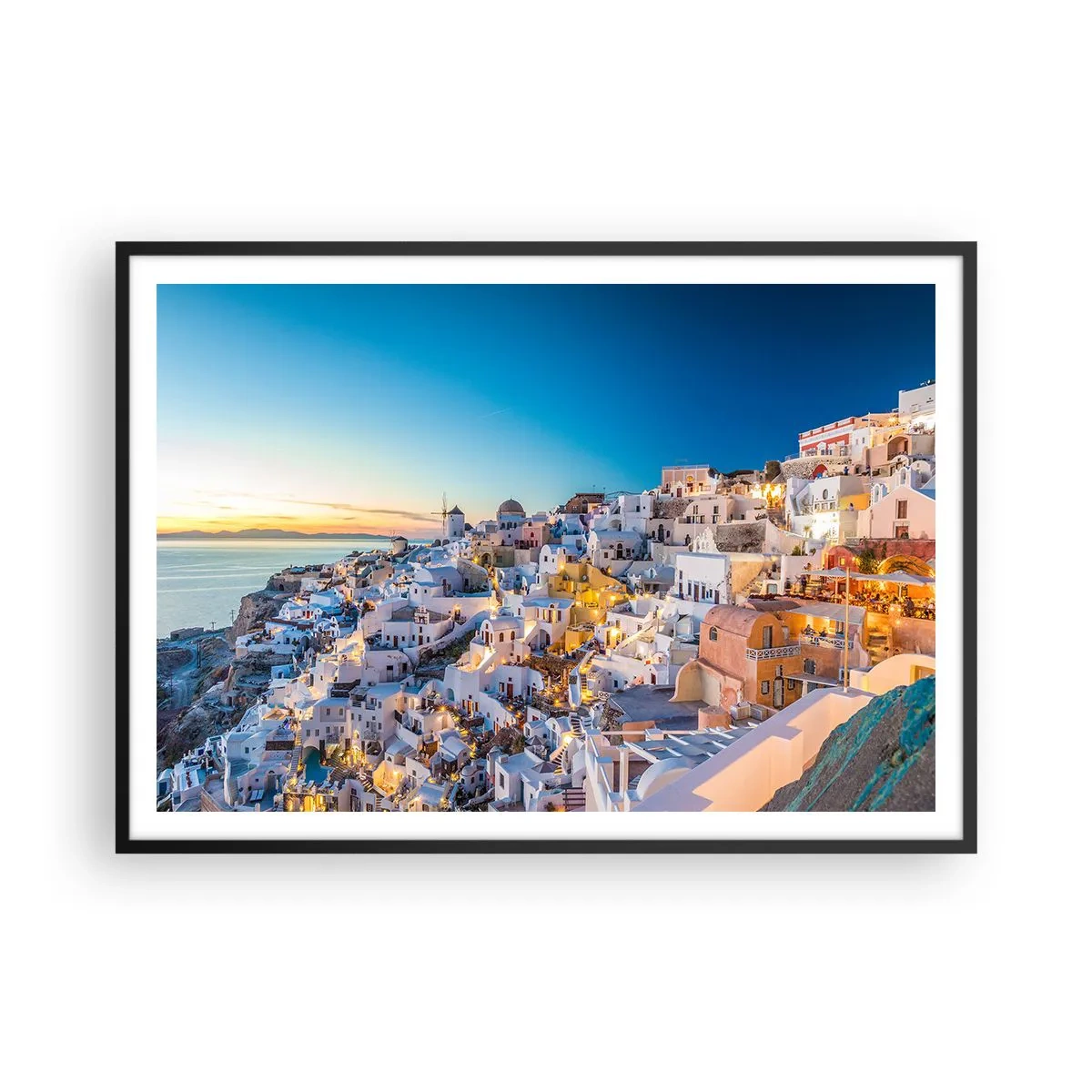 Plakat w czarnej ramie - Widok na greckie miasteczko o zachodzie słońca - 100x70cm - Esencja greckości - Nowoczesna dekoracja ścienna do salonu i sypialni ARTTOR