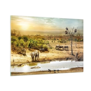 Obraz na szkle - Słonie i zwierzęta przy wodopoju na tle afrykańskiego krajobrazu - 100x70cm - "Z Edenu zaś wypływała rzeka…" - Nowoczesna dekoracja ścienna do salonu, kuchni i sypialni ARTTOR