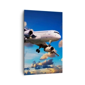 Obraz na płótnie - Samolot pasażerski na tle chmur o zachodzie słońca - 80x120cm - Podróż w bieli i błękicie - Nowoczesna dekoracja ścienna do salonu i sypialni ARTTOR