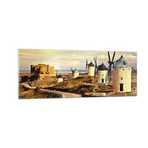 Obraz na szkle - Wiatraki na wzgórzach z historycznym zamkiem w tle - 140x50cm - Zaraz pojawi się Don Kichot - Nowoczesna dekoracja ścienna do salonu i sypialni ARTTOR