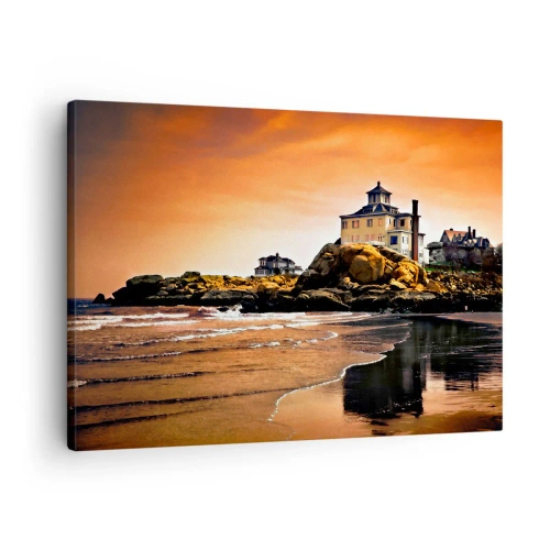 Obraz na płótnie - Dom na skale przy plaży o zachodzie słońca z odbiciem w wodzie - 70x50cm - Elegancja zachodniego wybrzeża - Nowoczesna dekoracja ścienna do salonu i sypialni ARTTOR
