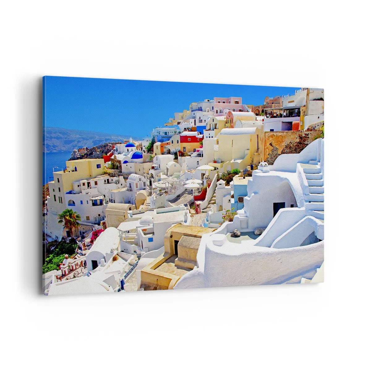 Obraz na płótnie - Panorama Santorini z białymi domami i błękitnym niebem - 100x70cm - Marzenie o greckim lecie - Nowoczesna dekoracja ścienna do salonu, kuchni i sypialni ARTTOR