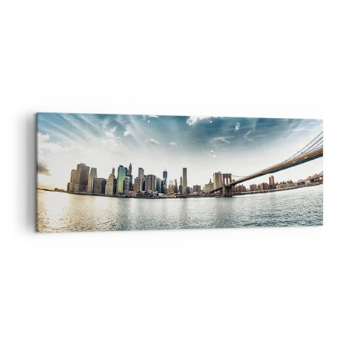 Obraz na płótnie - Panorama miasta z mostem na tle błękitnego nieba - 140x50cm - Szklana wyspa - Nowoczesna dekoracja ścienna do salonu i sypialni ARTTOR