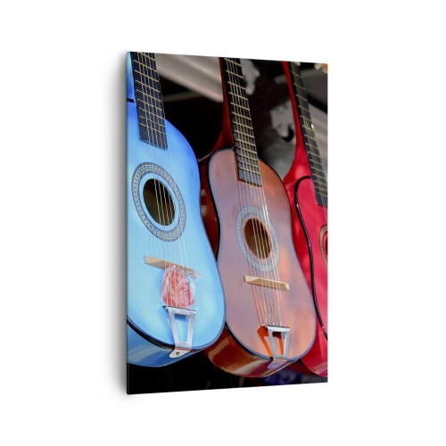 Obraz na płótnie - Kolorowe gitary akustyczne powieszone w rzędzie na wystawie - 80x120cm - Latynoskie klimaty - Nowoczesna dekoracja ścienna do salonu i sypialni ARTTOR
