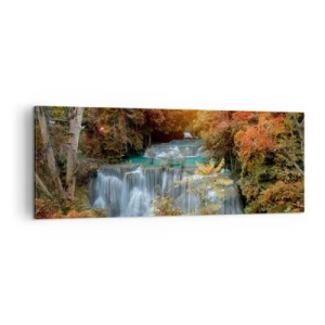 Obraz na płótnie - Jesienny wodospad otoczony kolorowymi drzewami w świetle słońca - 140x50cm - Ukryty skarb lasu - Nowoczesna dekoracja ścienna do salonu i sypialni ARTTOR