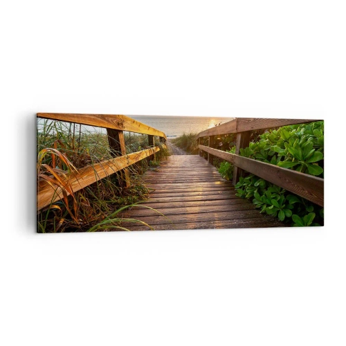 Obraz na płótnie - Drewniany pomost prowadzący na plażę o zachodzie słońca - 140x50cm - I wprost nad brzeg - Nowoczesna dekoracja ścienna do salonu i sypialni ARTTOR