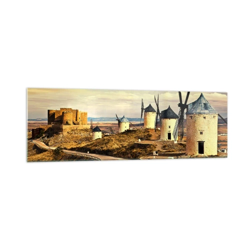 Obraz na szkle - Wiatraki na wzgórzach z historycznym zamkiem w tle - 160x50cm - Zaraz pojawi się Don Kichot - Nowoczesna dekoracja ścienna do salonu i sypialni ARTTOR