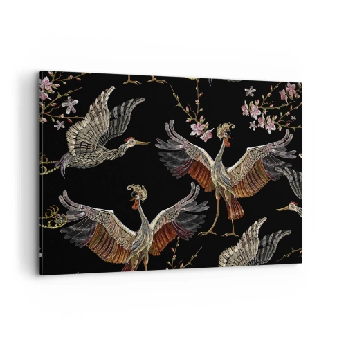 Obraz na płótnie - Stylowe żurawie i kwiaty na czarnym tle - 100x70cm - Baśniowy ptak - Nowoczesna dekoracja ścienna do salonu, kuchni i sypialni ARTTOR