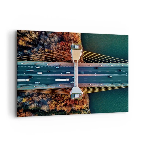 Obraz na płótnie - Most widziany z lotu ptaka nad rzeką i jesiennym krajobrazem - 100x70cm - ZA wodami, za lasami - Nowoczesna dekoracja ścienna do salonu, kuchni i sypialni ARTTOR