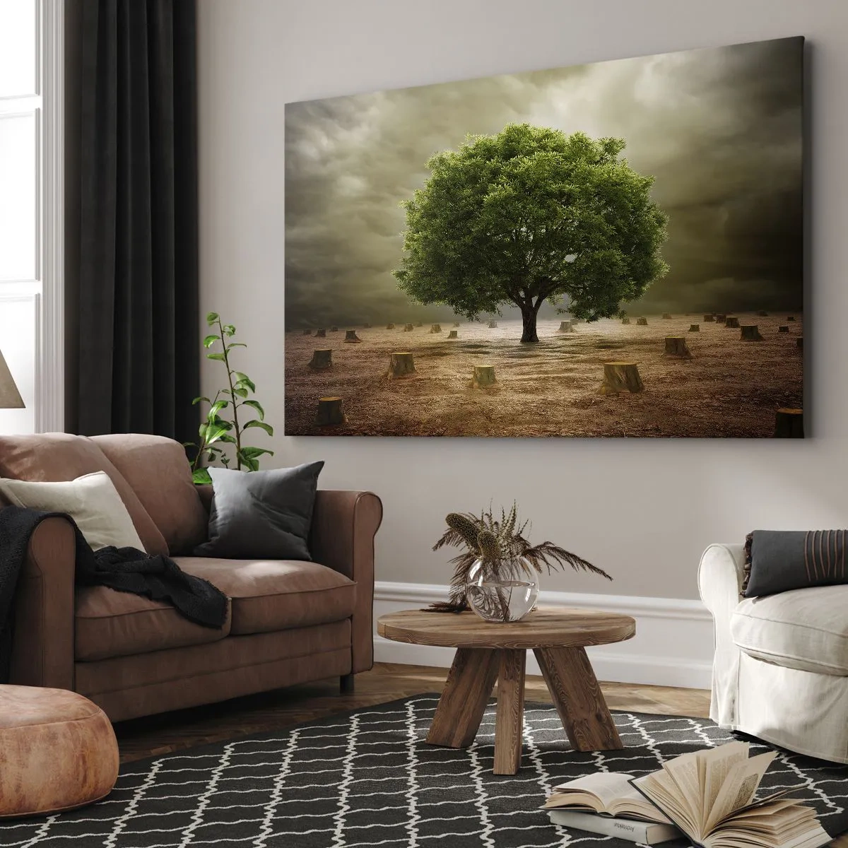 Obraz na płótnie - Zielone drzewo otoczone pniami ściętych drzew na tle pochmurnego nieba - 120x80cm - Cała nadzieja - Nowoczesna dekoracja ścienna do salonu, kuchni i sypialni ARTTOR