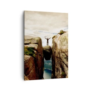 Obraz na płótnie - Człowiek stojący na zaklinowanym kamieniu między skałami - 50x70cm - Jak się czuję?! - Nowoczesna dekoracja ścienna do salonu, kuchni i sypialni ARTTOR