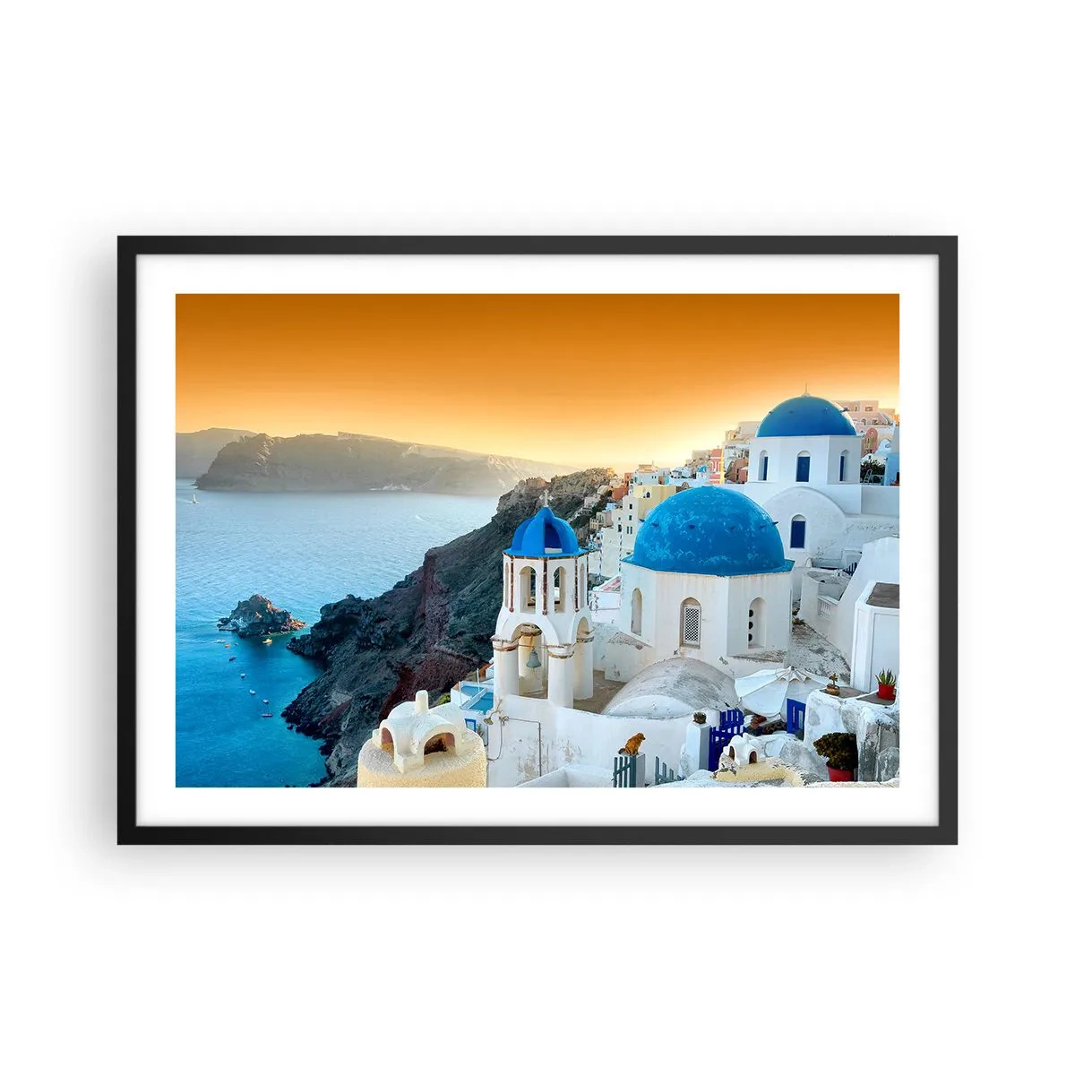Plakat w czarnej ramie - Widok na Santorini z białymi budynkami i błękitnym morzem - 70x50cm - Santorini - przytulone do skał - Nowoczesna dekoracja ścienna do salonu i sypialni ARTTOR