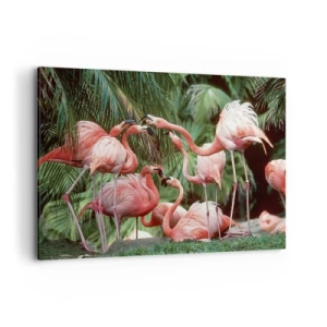 Obraz na płótnie - Grupa flamingów w tropikalnym otoczeniu palm - 100x70cm - Popołudniowe ploteczki - Nowoczesna dekoracja ścienna do salonu, kuchni i sypialni ARTTOR