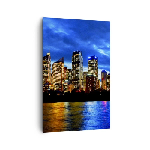 Obraz na płótnie - Panorama nocnego miasta z podświetlonymi wieżowcami nad wodą - 80x120cm - Noc świateł i barw - Nowoczesna dekoracja ścienna do salonu i sypialni ARTTOR