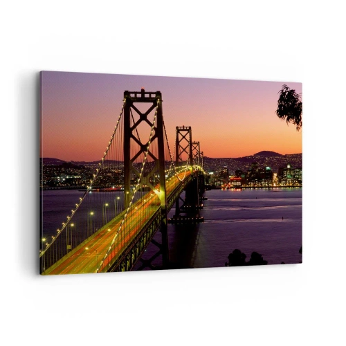 Obraz na płótnie - Most podświetlony nocą nad wodą z panoramą miasta - 100x70cm - Wieczór we fiolecie - Nowoczesna dekoracja ścienna do salonu, kuchni i sypialni ARTTOR