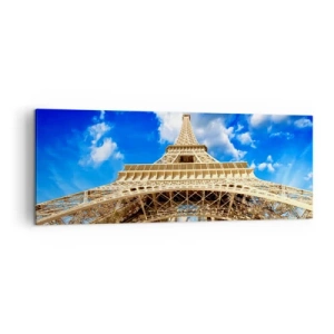 Obraz na płótnie - Wieża Eiffla z perspektywy dolnej na tle błękitnego nieba - 140x50cm - Sięgając nieba i chmur - Nowoczesna dekoracja ścienna do salonu i sypialni ARTTOR
