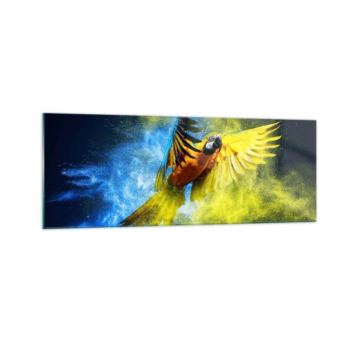 Obraz na szkle - Papuga w locie na tle kolorowych eksplozji żółtego i niebieskiego - 140x50cm - W błękitno-złotym pyle - Nowoczesna dekoracja ścienna do salonu i sypialni ARTTOR