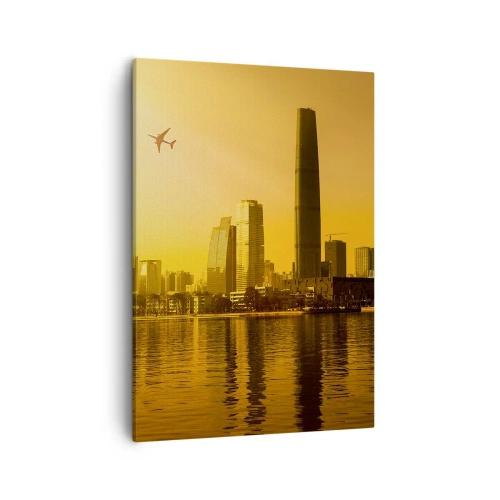 Obraz na płótnie - Nowoczesne miasto o zachodzie słońca z samolotem na niebie - 50x70cm - Złote miasto - Nowoczesna dekoracja ścienna do salonu, kuchni i sypialni ARTTOR