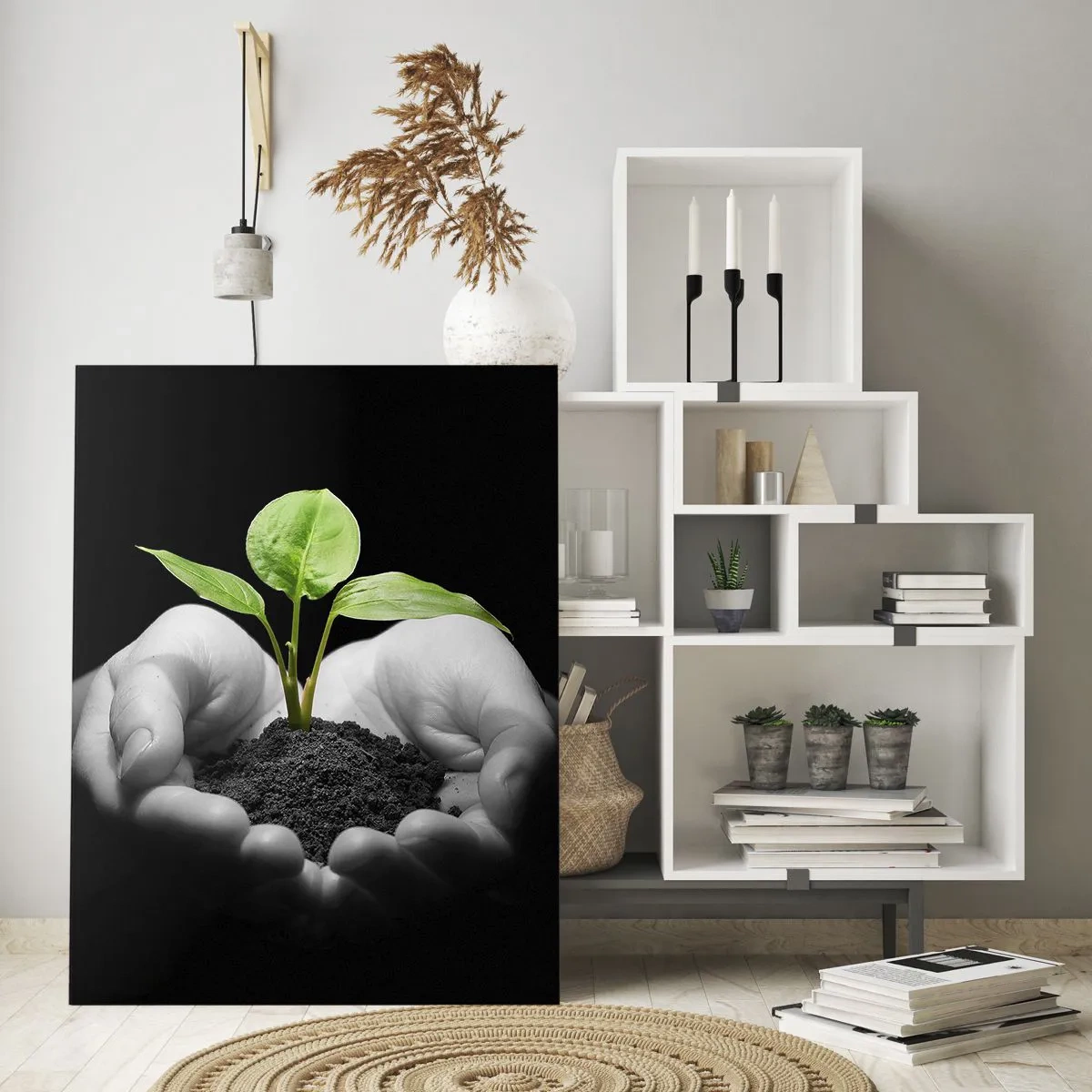 Obraz na szkle - Dłonie trzymające zieloną roślinę na czarnym tle - 70x100cm - Kocham naturę, chronię ją - Nowoczesna dekoracja ścienna do salonu i sypialni ARTTOR