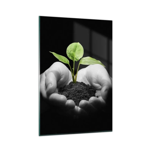 Obraz na szkle - Dłonie trzymające zieloną roślinę na czarnym tle - 80x120cm - Kocham naturę, chronię ją - Nowoczesna dekoracja ścienna do salonu i sypialni ARTTOR